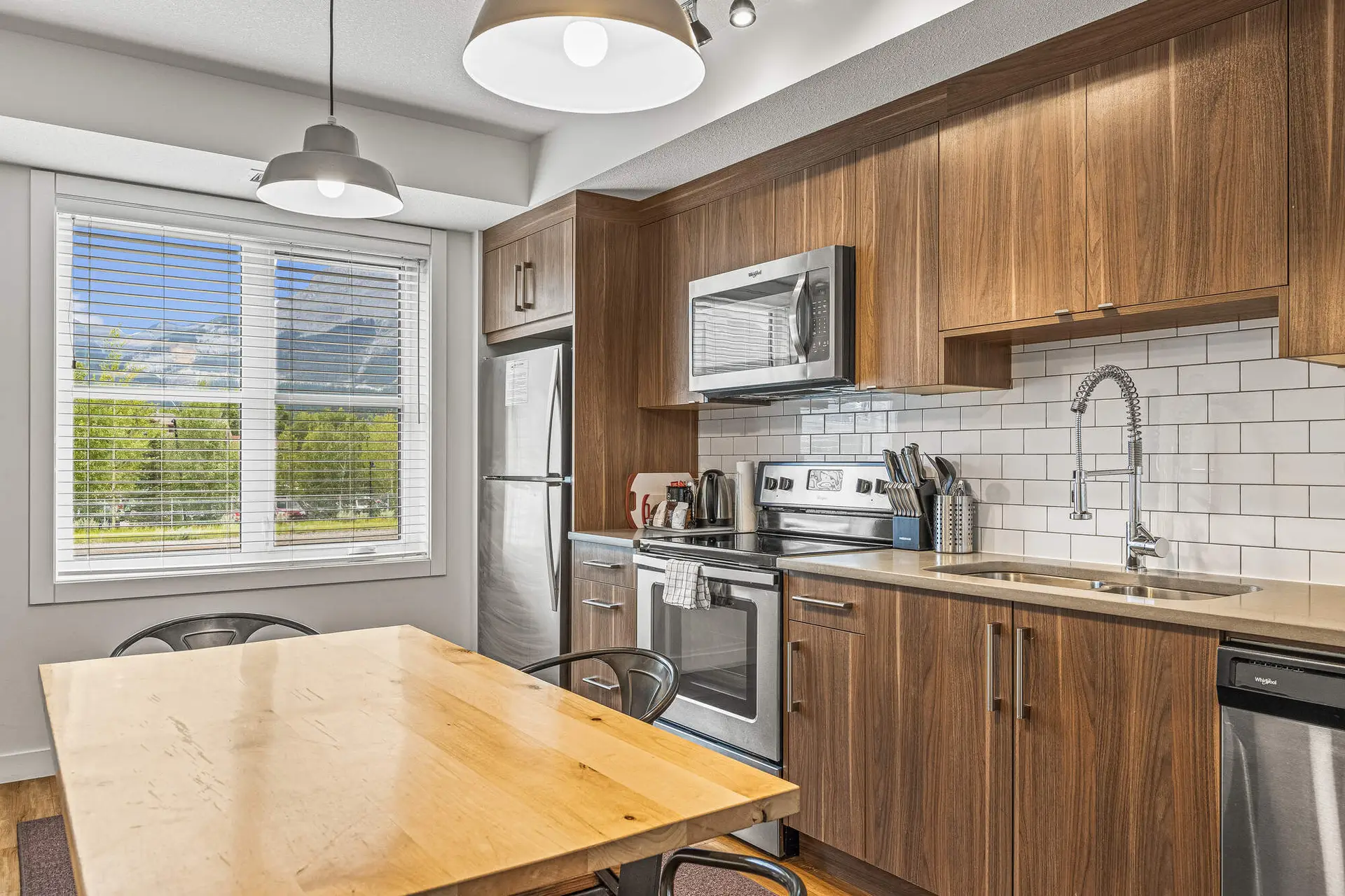 Modern kitchen in Basecamp Resorts Canmore two-bedroom suite with mountain view