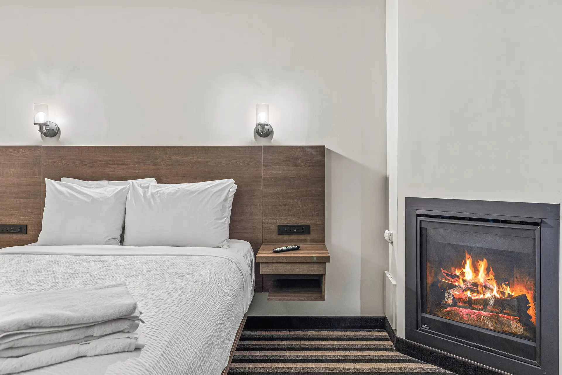 Deluxe double queen room at Basecamp Northwinds Canmore with fireplace