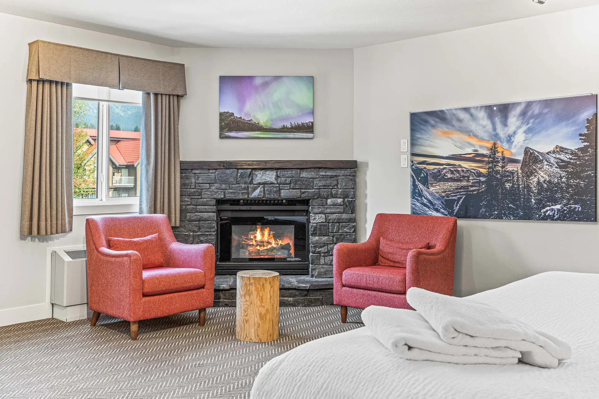 King Suite at Basecamp Lodge Canmore with fireplace and mountain art