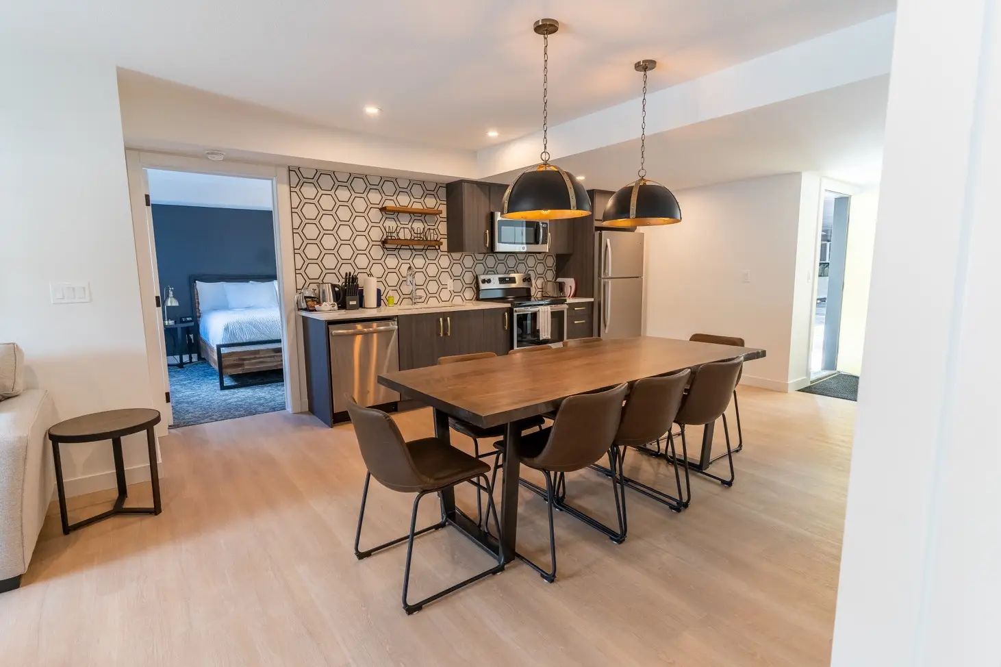 Canmore three bedroom apartment dining and kitchen area with stylish decor.