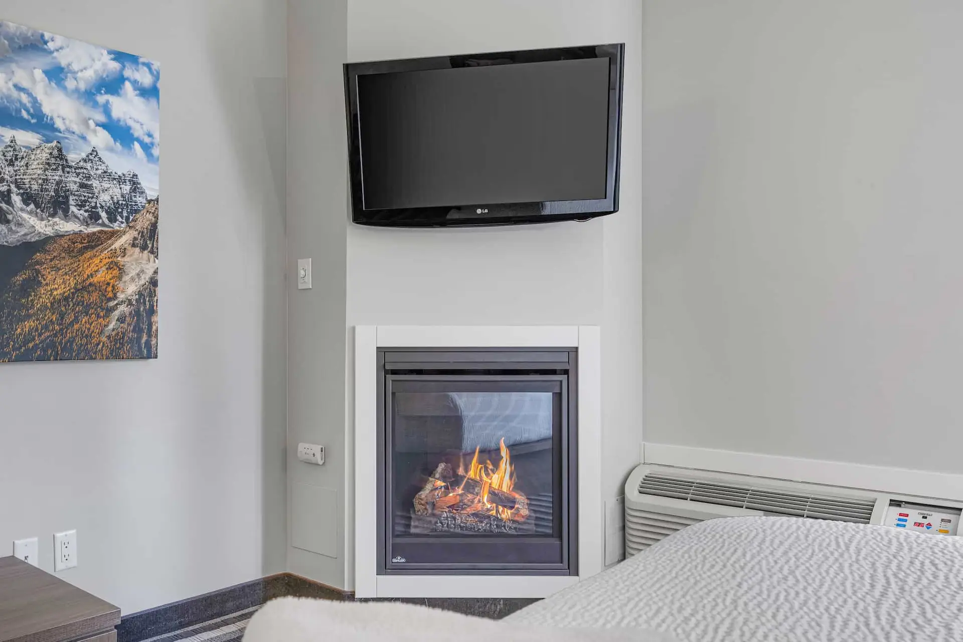 Deluxe King Room at Basecamp Northwinds Canmore with fireplace and TV