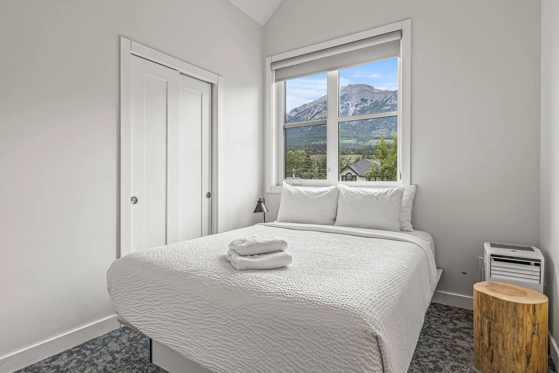 Bedroom in Basecamp Resorts Canmore Six Bedroom Suite with mountain view