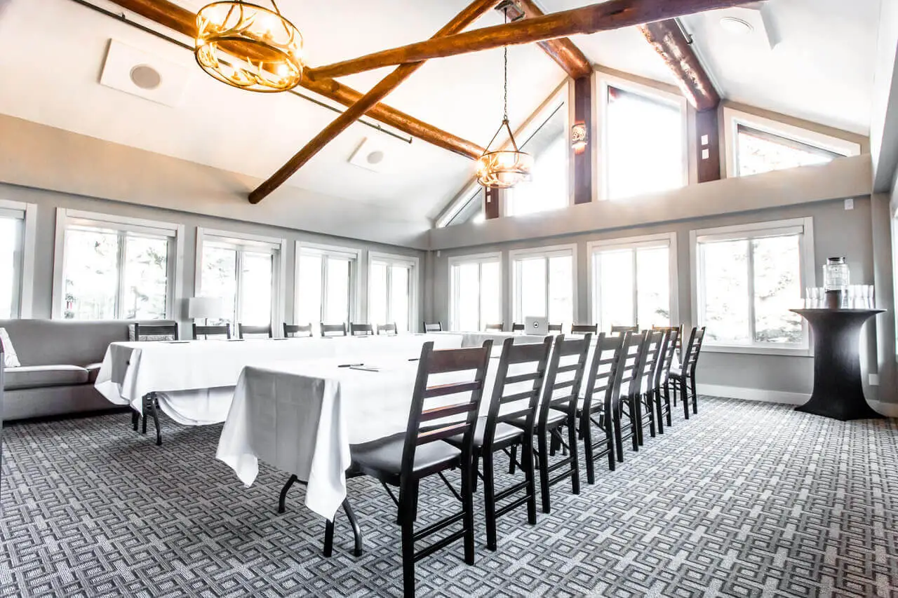Basecamp Lodge Canmore: Conference room with long table, chairs, and rustic beams