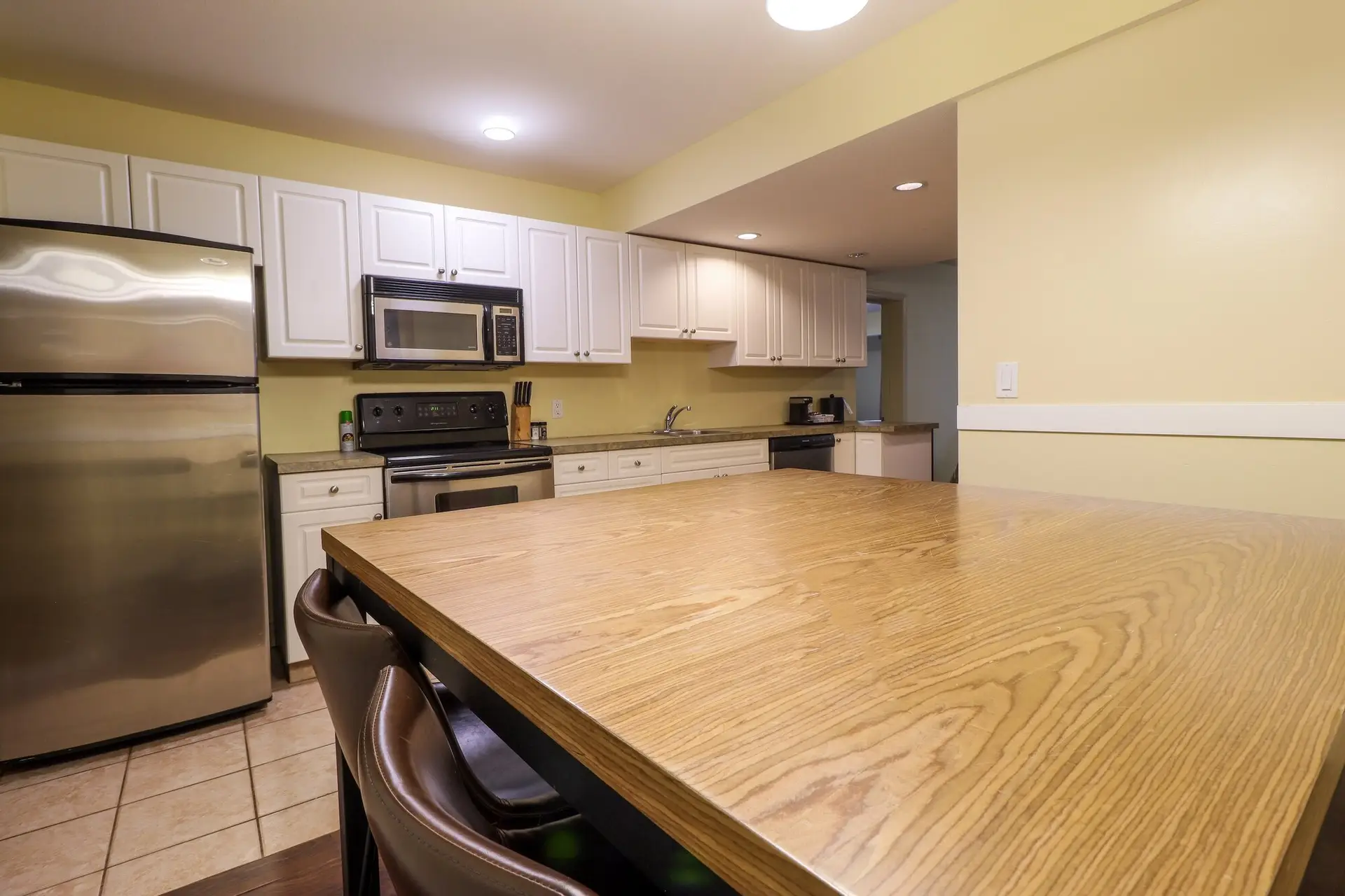 Basecamp Northwinds Revelstoke apartment kitchen with dining table
