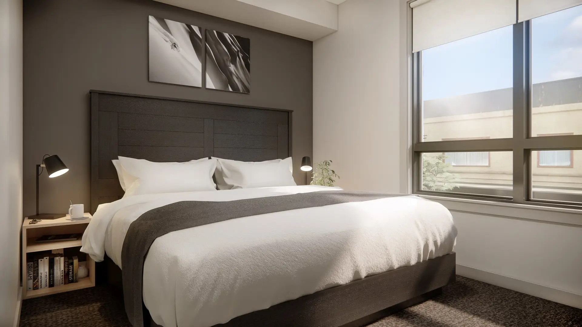 Basecamp Suites Revelstoke six-bedroom suite with modern furnishings and large window.