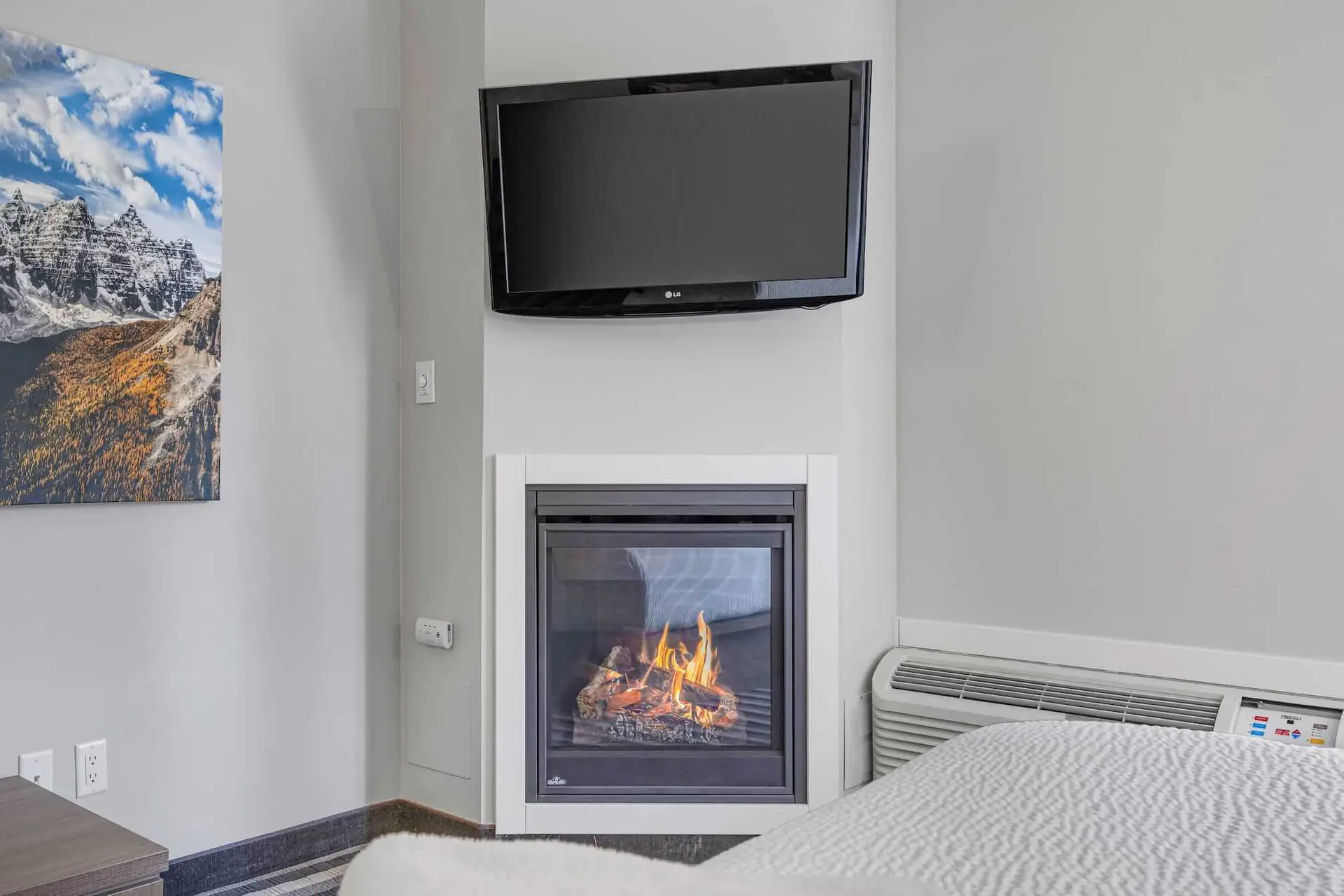 Double Queen room at Basecamp Northwinds Canmore with fireplace and TV