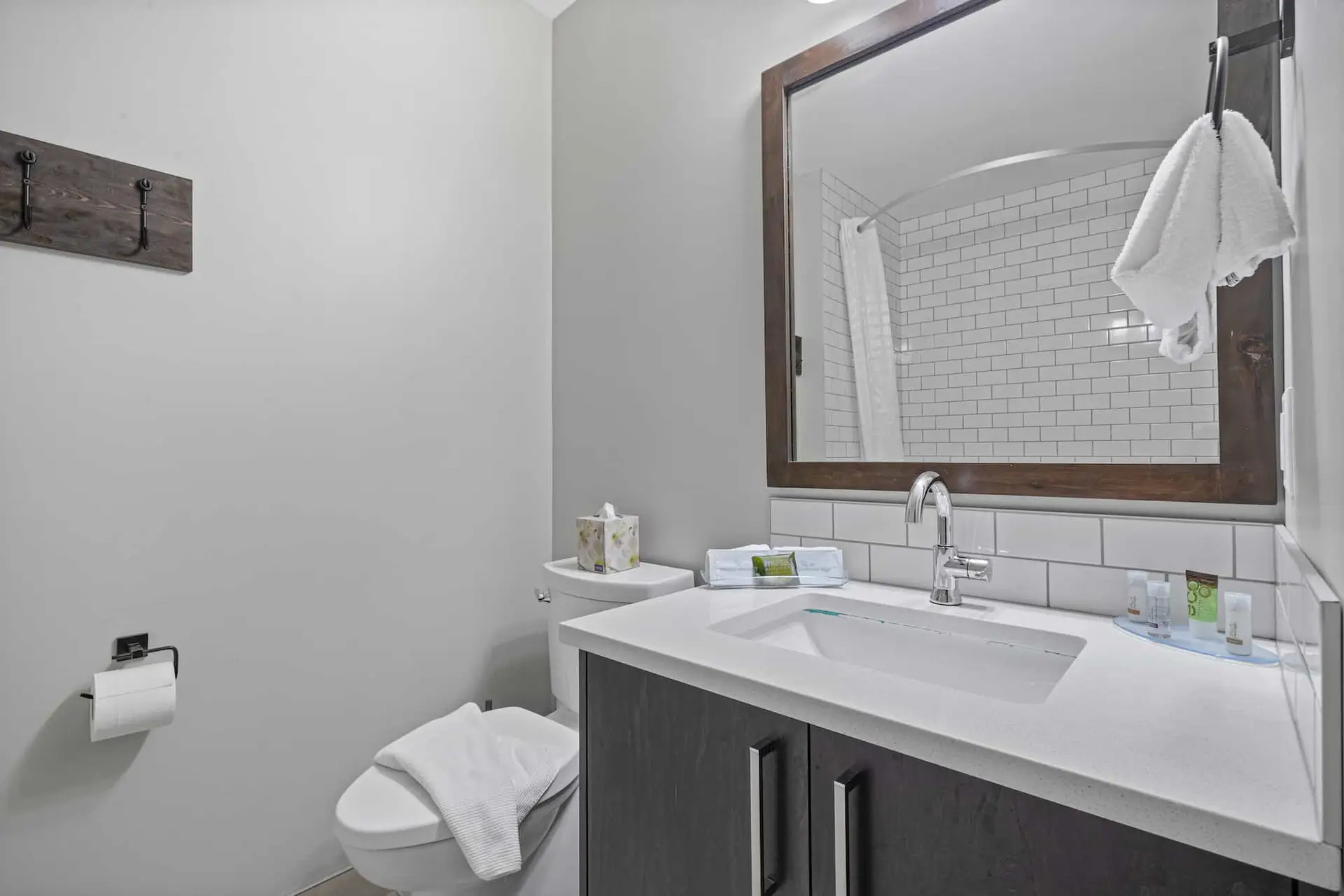 Deluxe Queen room bathroom at Basecamp Northwinds Canmore with vanity and toilet