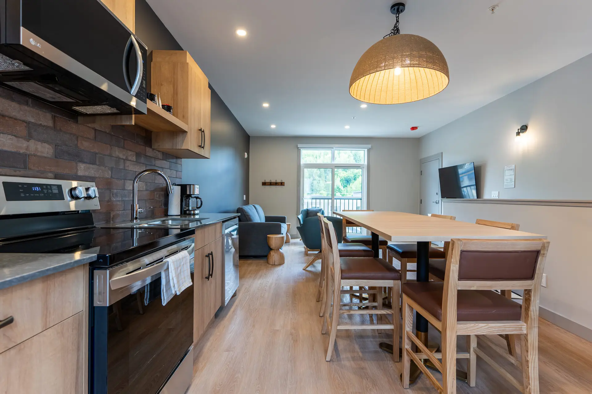 Basecamp Suites Revelstoke four bedroom suite kitchen and dining area