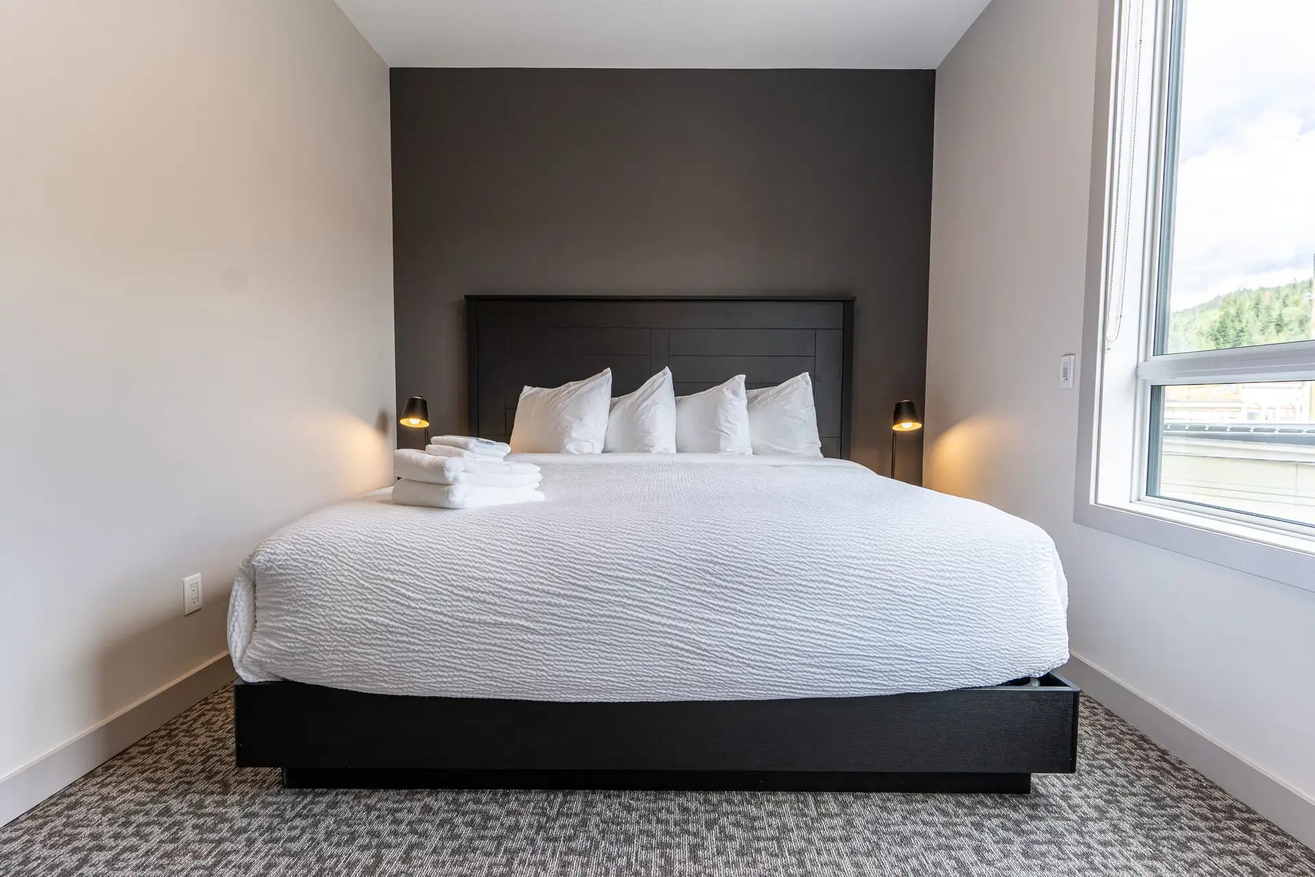 Four bedroom suite at Basecamp Suites Revelstoke featuring a king-size bed