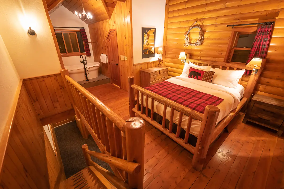 Basecamp Baker Creek Superior Jacuzzi Suite bedroom with jacuzzi tub