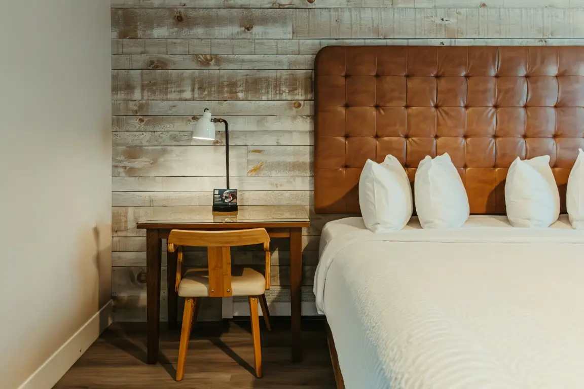 Canmore King room at Basecamp Lamphouse, dog-friendly accommodation with desk and bed.