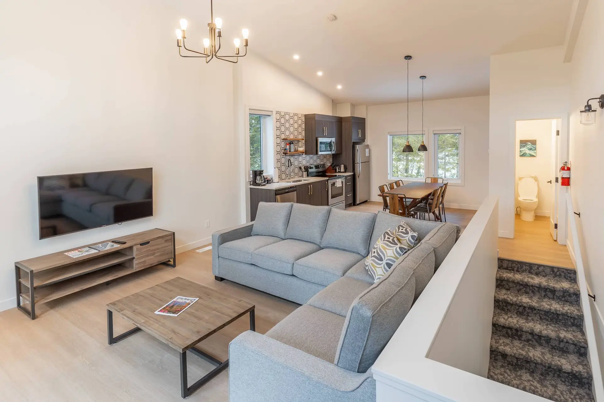 Revelstoke four bedroom suite living area with kitchen and dining