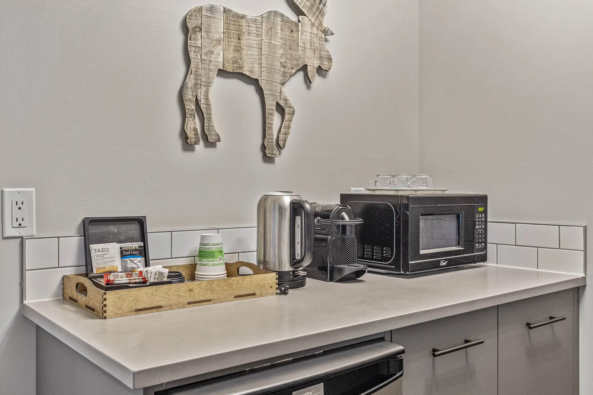 Canmore Queen Suite kitchenette with coffee maker, microwave, and tea.