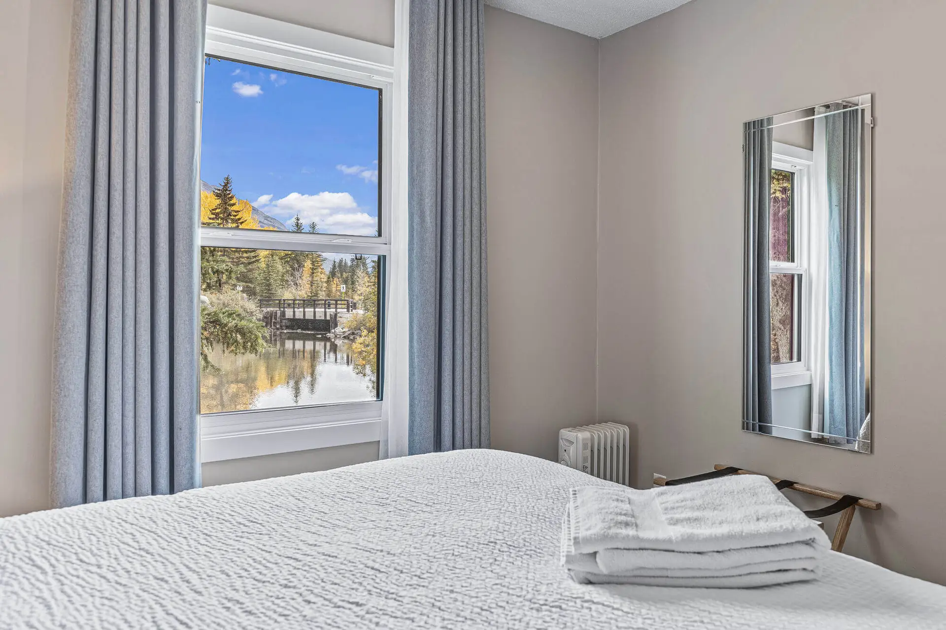 Basecamp Lamphouse Queen Suite bedroom with mountain view