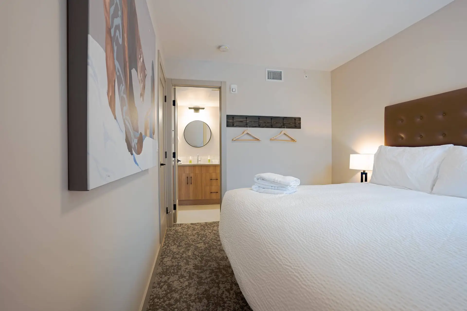 Basecamp Suites Banff Superior Two King Suite bedroom with king bed, modern decor