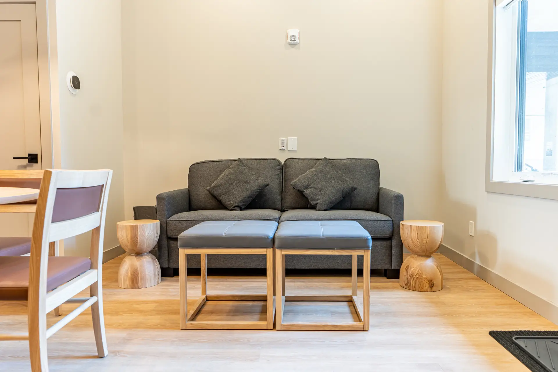 Comfortable seating area in Basecamp Suites Revelstoke one bedroom suite