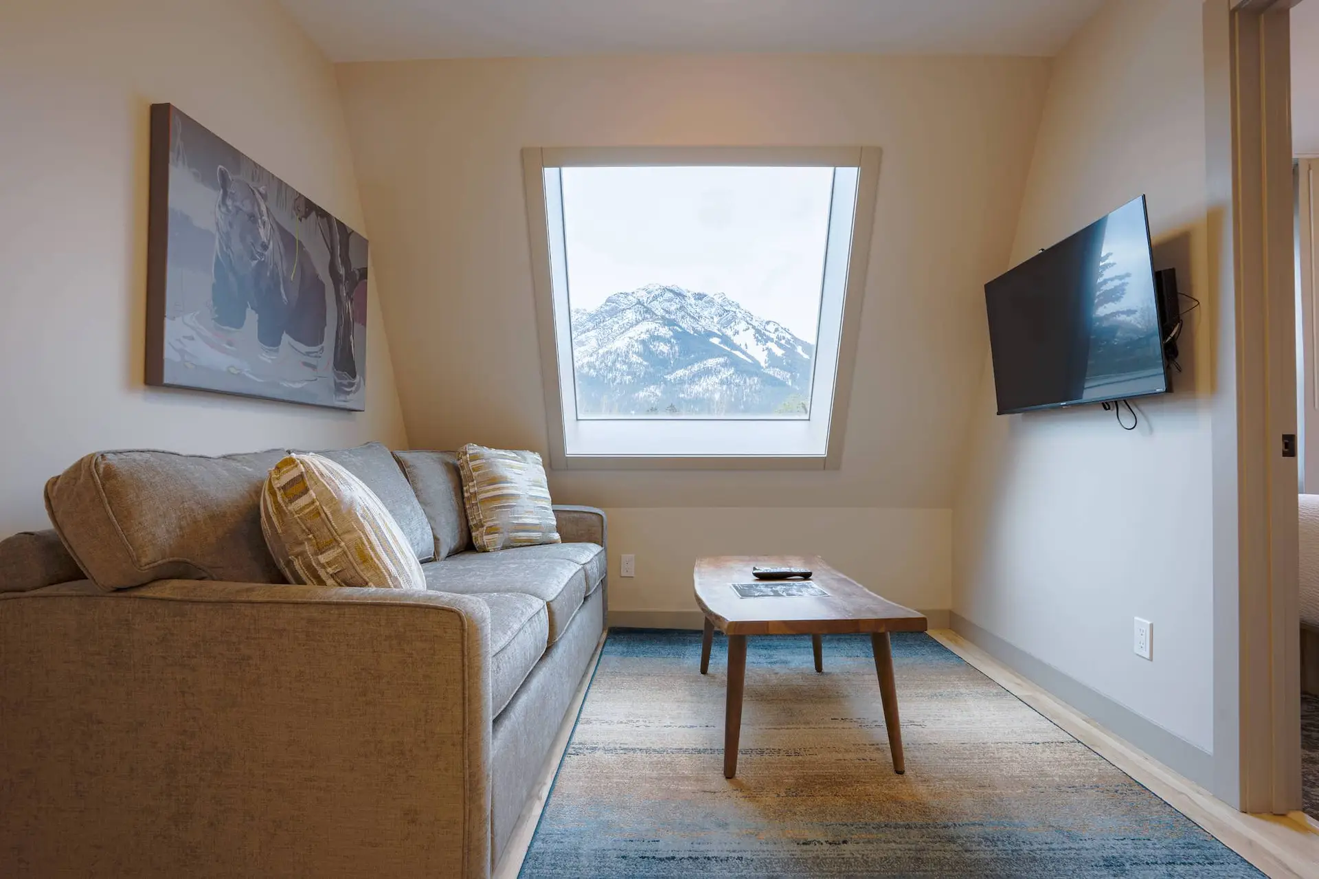 Cozy living area in Basecamp Suites Banff two-bedroom suite with mountain view