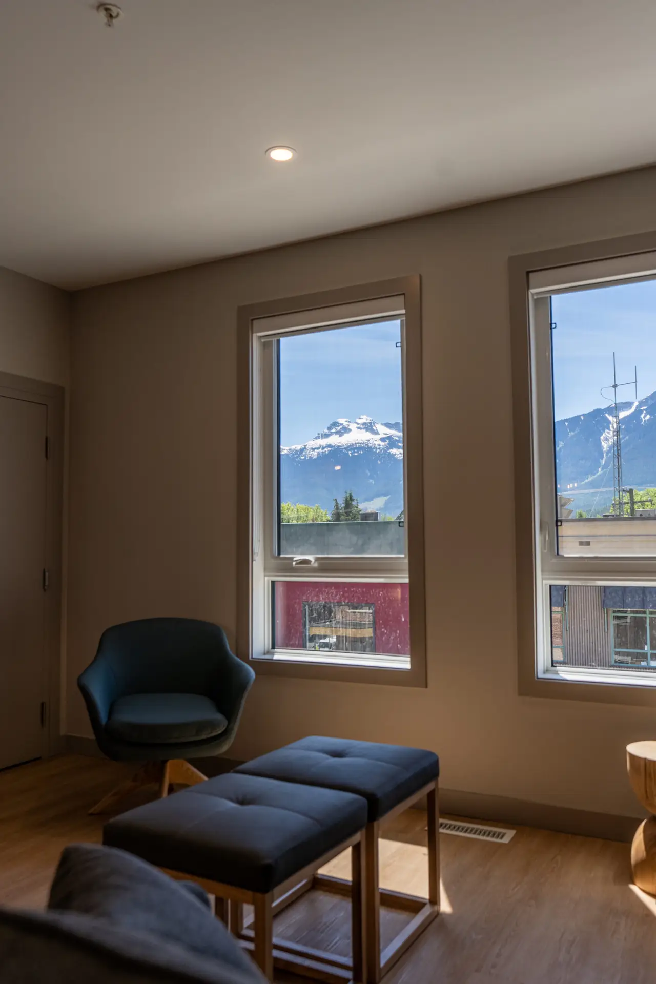 Interior of a two-bedroom suite at Basecamp Suites Revelstoke with mountain views.