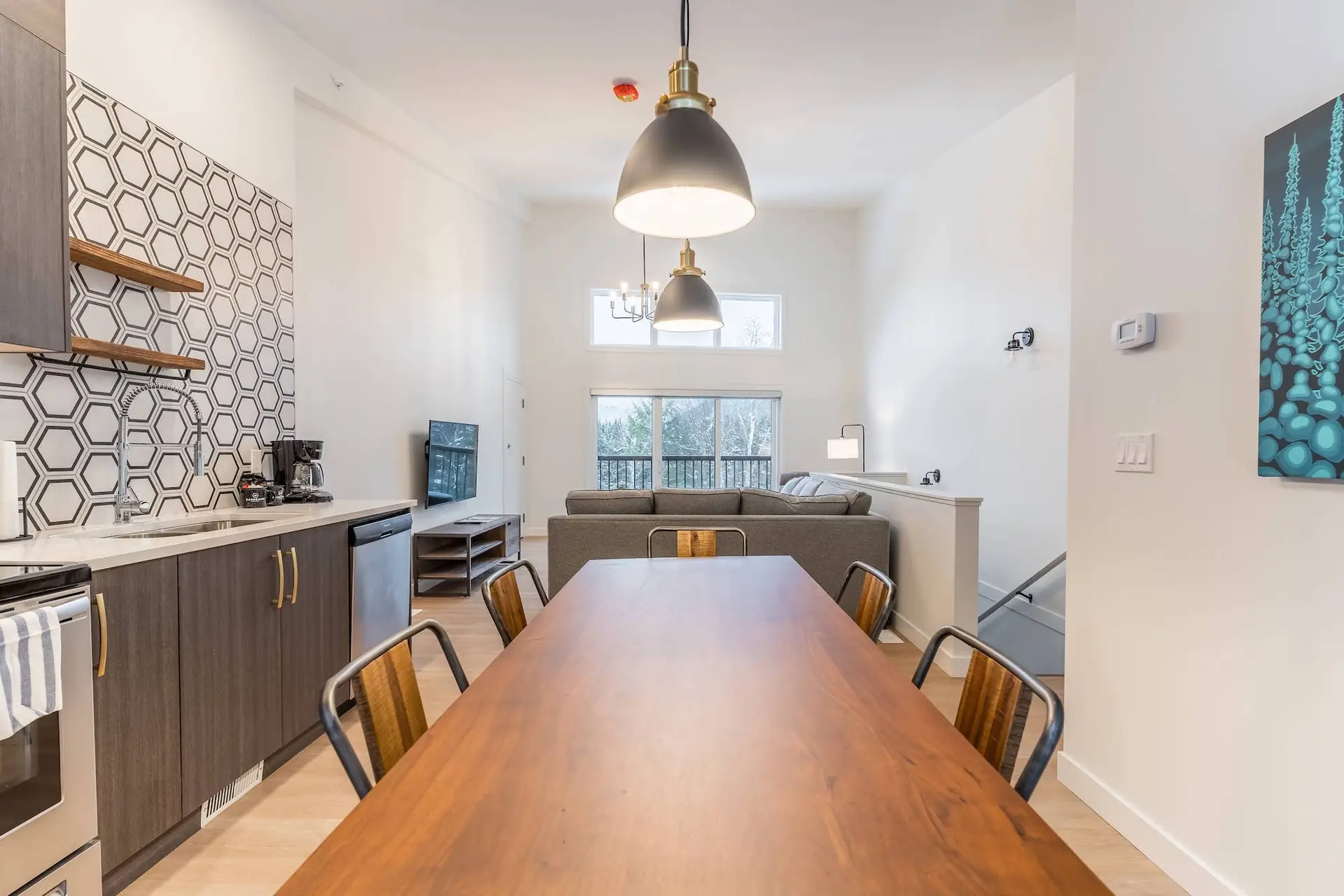 Basecamp Resorts Revelstoke two-bedroom suite dining and living area