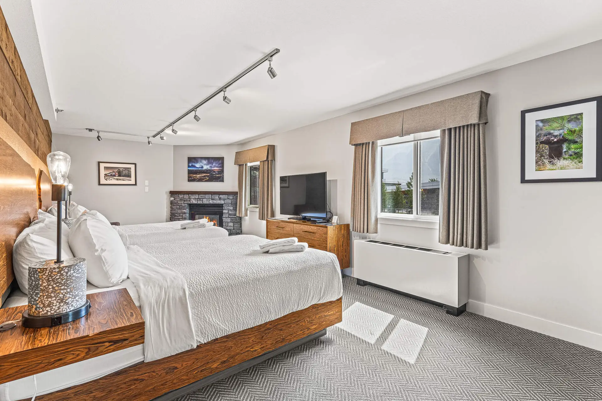 Deluxe Double Queen Room at Basecamp Lodge Canmore with fireplace and mountain view
