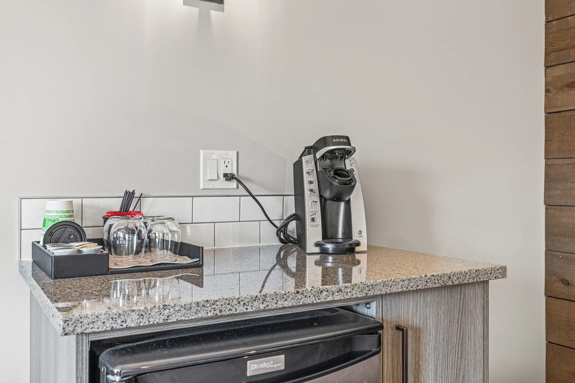 Keurig coffee maker and mini-fridge in Basecamp Lodge Canmore Deluxe Double King Room