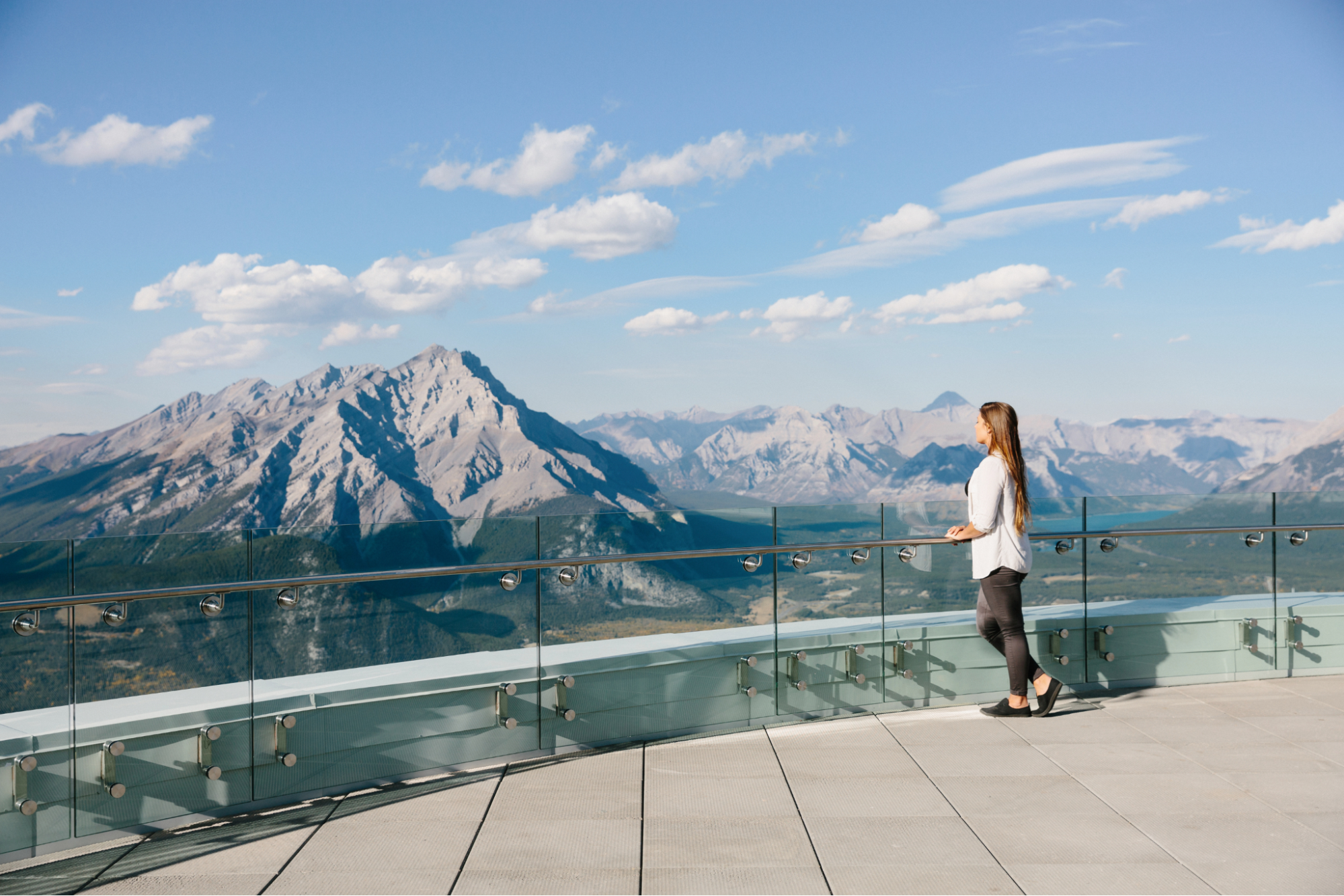 Woman overlooking Canadian Rockies from Banff Gondola viewpoint