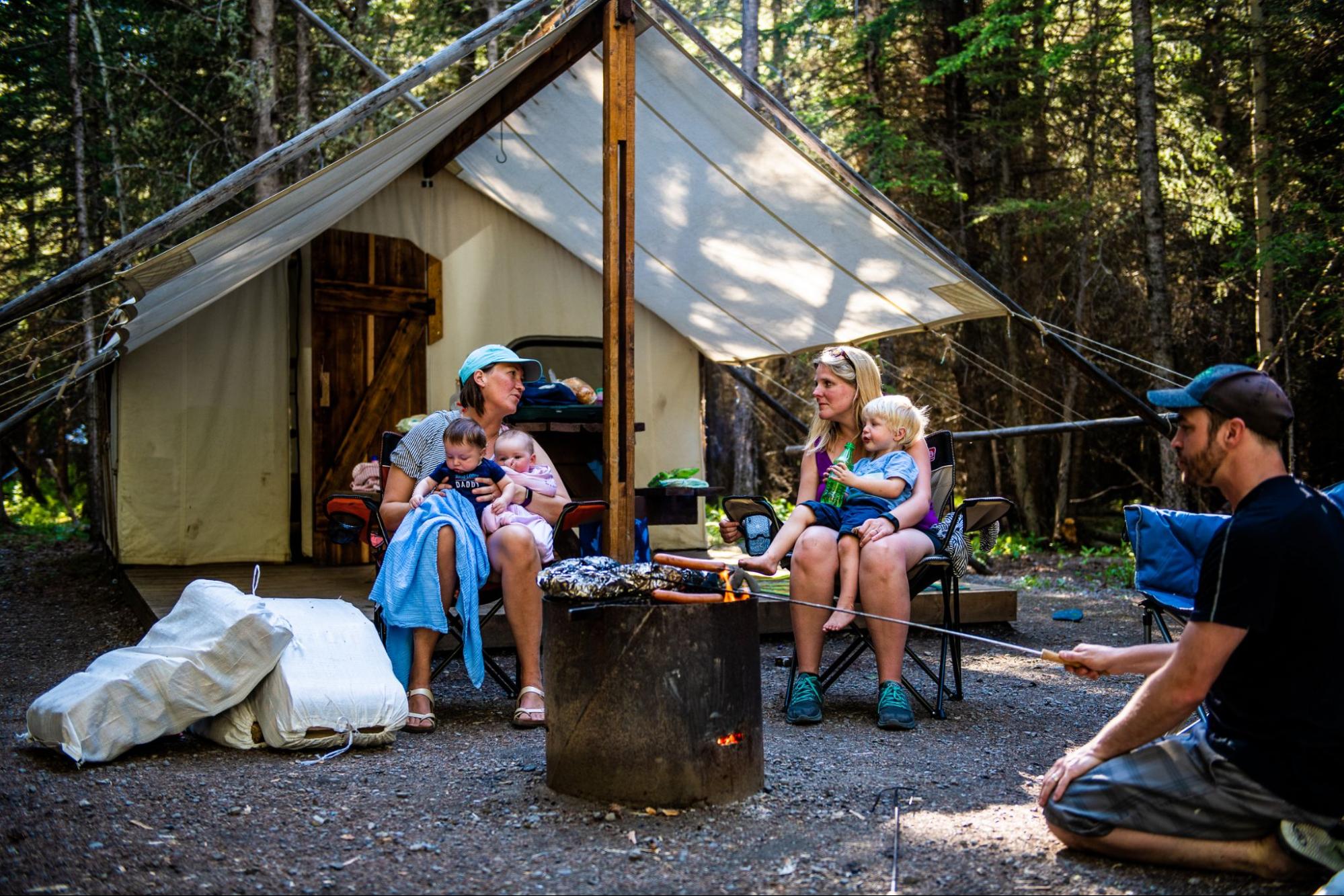 Family cooking by the fire at Sundance by Basecamp