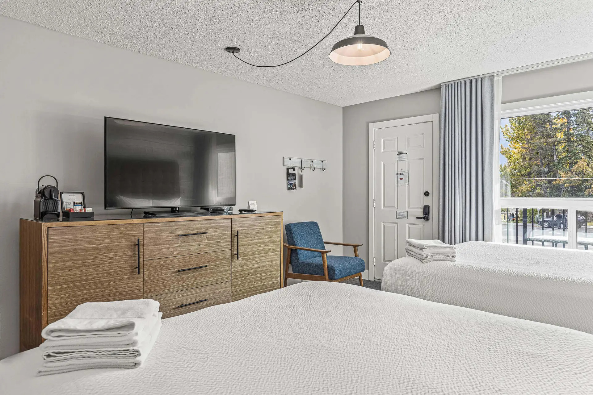 Basecamp Lamphouse Canmore double Queen bedroom with mountain view
