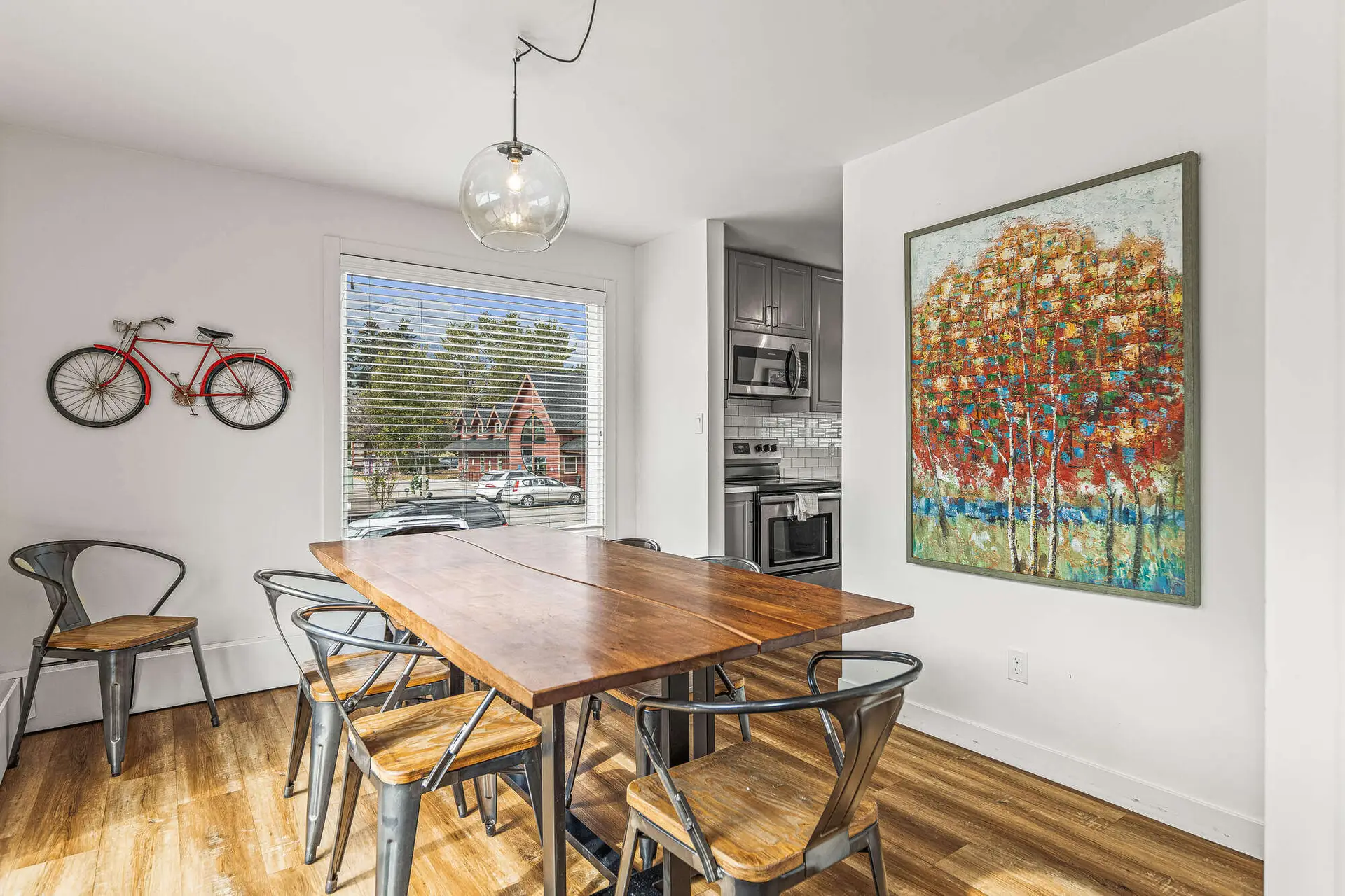 Dining area in Basecamp Lamphouse Canmore with wooden table and chairs